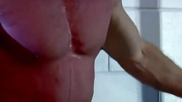 Muscular man is bound and whipped by his master