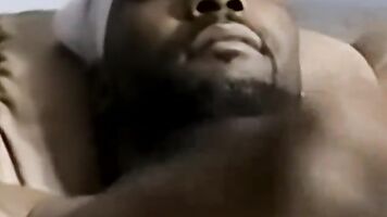 Black stud jerking off and getting his fat cock sucked