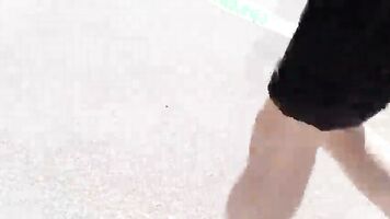 Jon Arteen walks barefoot on the street outdoors, the boy is barefoot in the crowded tram to the town center