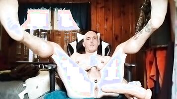 Tattooed Guy Playing With Toys
